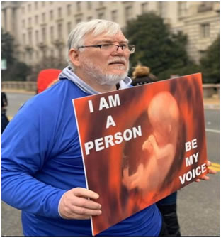 Grand Knight Eddie Williams and Father Nohe at the March in D.C